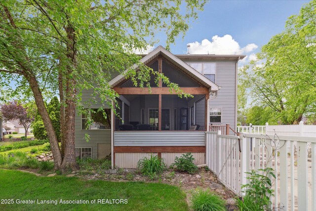 11610 Hibiscus Ln, Grand Ledge, MI 48837 - rear view of house featuring a sunroom