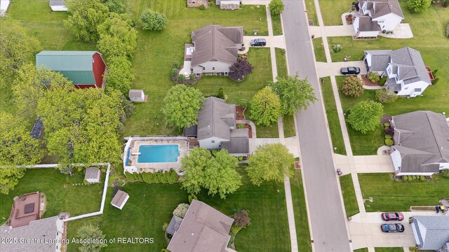 11610 Hibiscus Ln, Grand Ledge, MI 48837 - aerial view of property and surrounding area featuring nearby suburban area and a pool