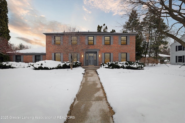 colonial house with brick siding