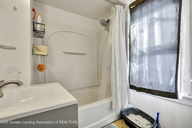 bathroom featuring shower / bath combination with curtain and vanity