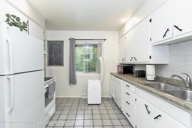 kitchen with white appliances, a sink, light countertops, white cabinetry, and backsplash