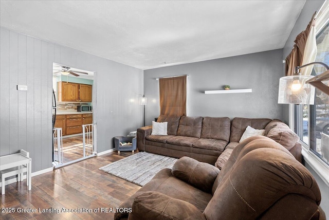 living room featuring wood finished floors and baseboards