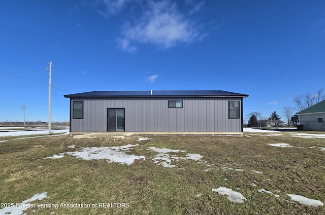 back of property with metal roof