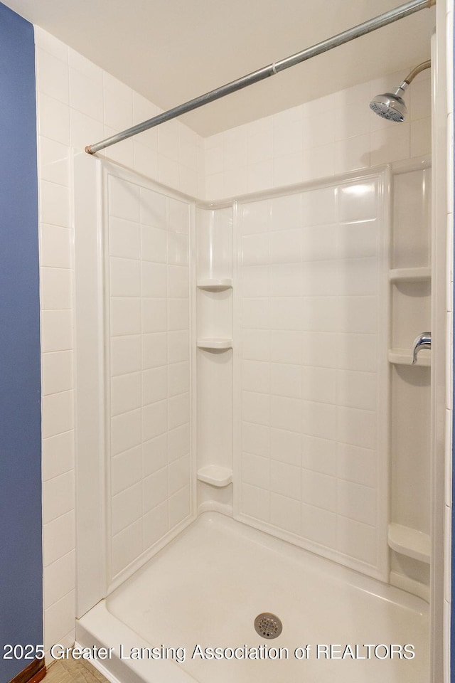 full bathroom featuring a stall shower