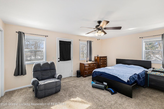 bedroom with baseboards, a ceiling fan, and light colored carpet