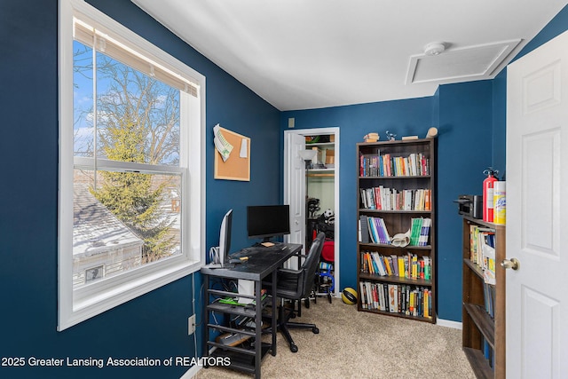 office with carpet floors, attic access, and baseboards