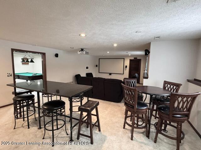 dining area featuring billiards, baseboards, light colored carpet, a textured ceiling, and recessed lighting