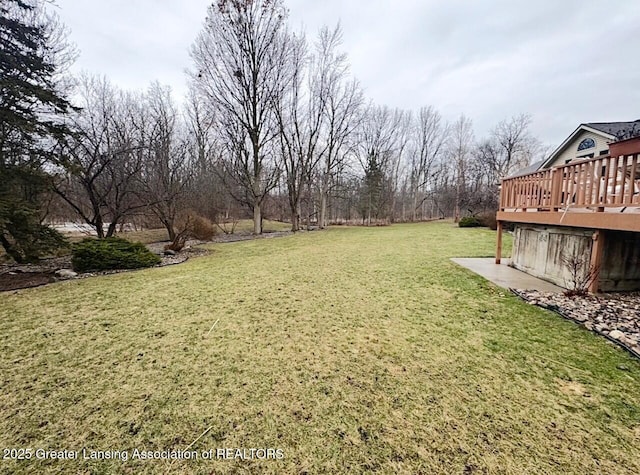 view of yard with a wooden deck