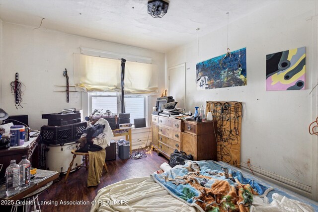 bedroom featuring dark wood-style floors