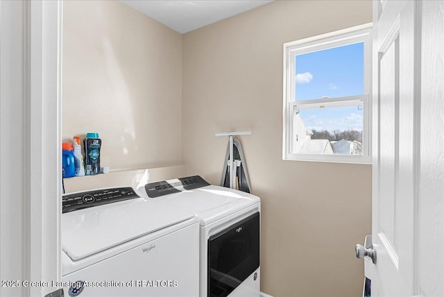 clothes washing area featuring laundry area and independent washer and dryer