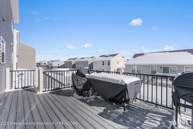 wooden terrace featuring a residential view and grilling area