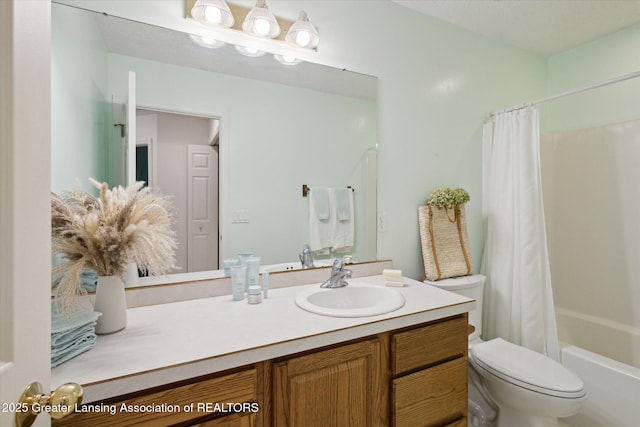 bathroom featuring shower / tub combo, vanity, and toilet