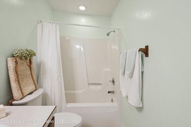 full bath featuring toilet, shower / bath combo, and vanity