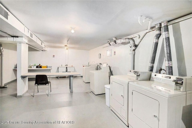 laundry area featuring laundry area, visible vents, and washer and clothes dryer