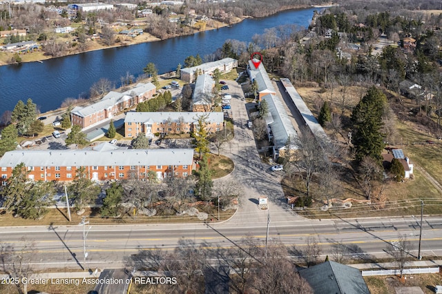 birds eye view of property with a water view