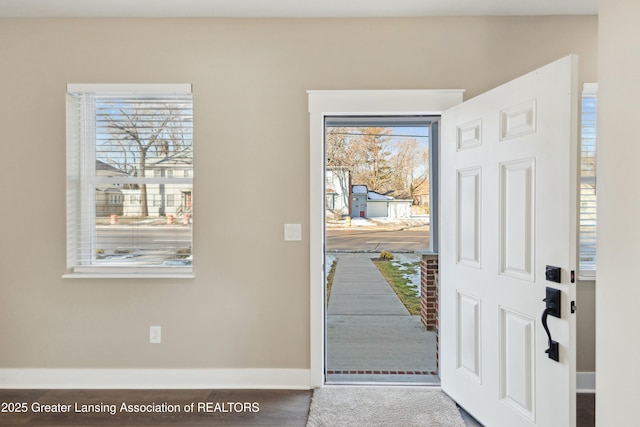 entryway featuring baseboards