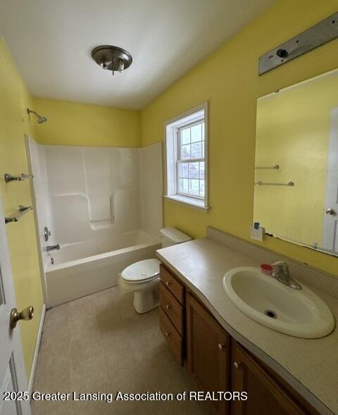 full bathroom featuring  shower combination, vanity, and toilet