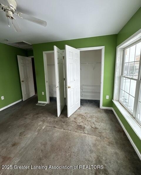 unfurnished bedroom with carpet floors and baseboards