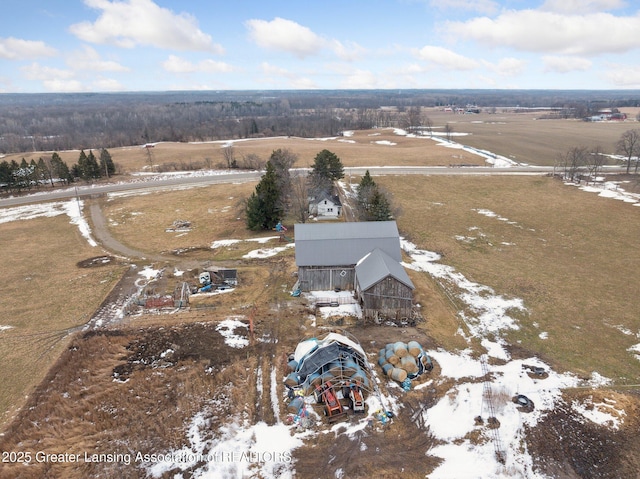 snowy aerial view featuring a rural view