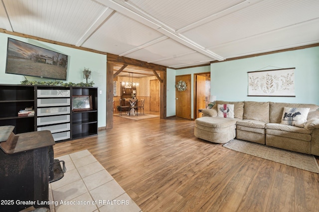 living room featuring a chandelier and wood finished floors