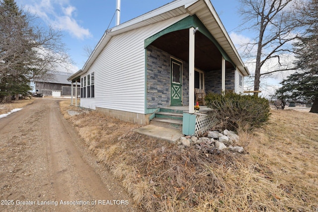 view of front of house featuring stone siding