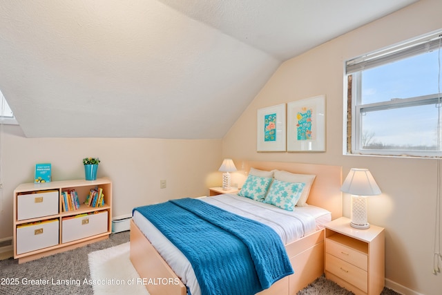 bedroom with baseboards, lofted ceiling, a textured ceiling, carpet flooring, and a baseboard heating unit