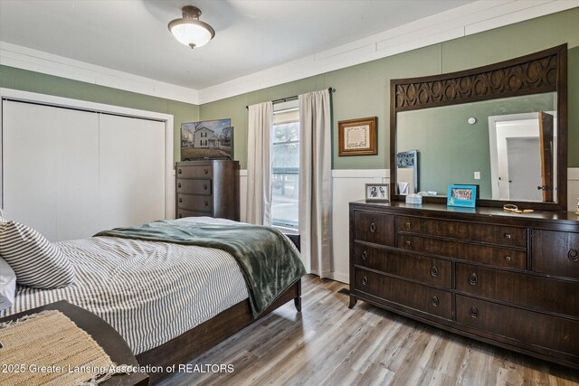 bedroom featuring a closet and wood finished floors