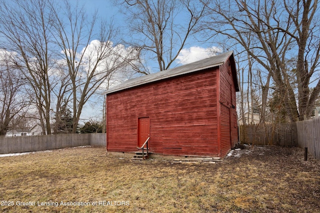 view of outbuilding with an outbuilding and a fenced backyard