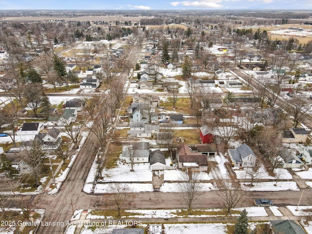 snowy aerial view with a residential view