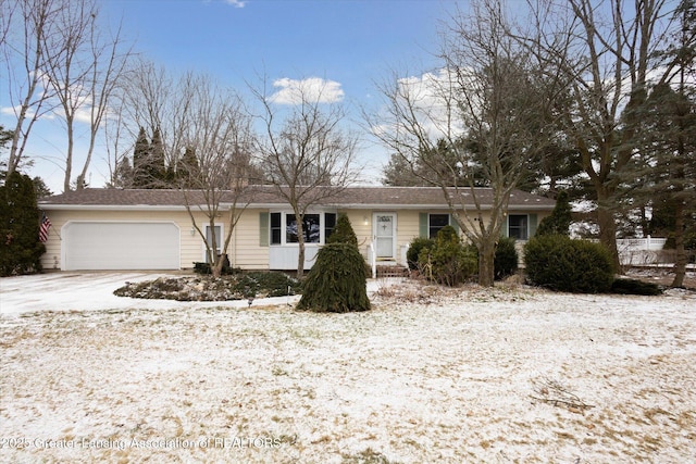 ranch-style home with driveway and an attached garage