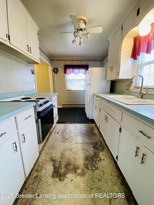 kitchen featuring a sink, white cabinetry, light countertops, baseboard heating, and electric range oven