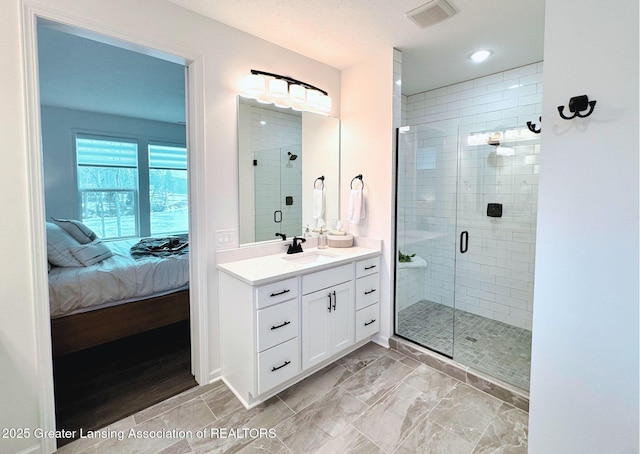 bathroom featuring ensuite bath, vanity, visible vents, and a shower stall