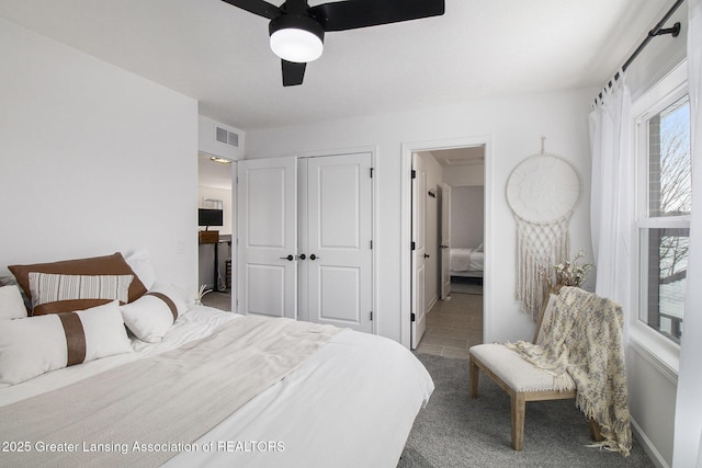 bedroom with ceiling fan, multiple windows, a closet, and visible vents