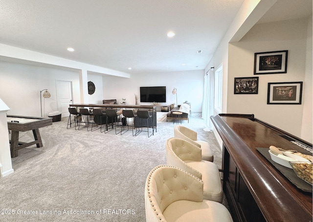 interior space with recessed lighting, carpet flooring, and a dry bar