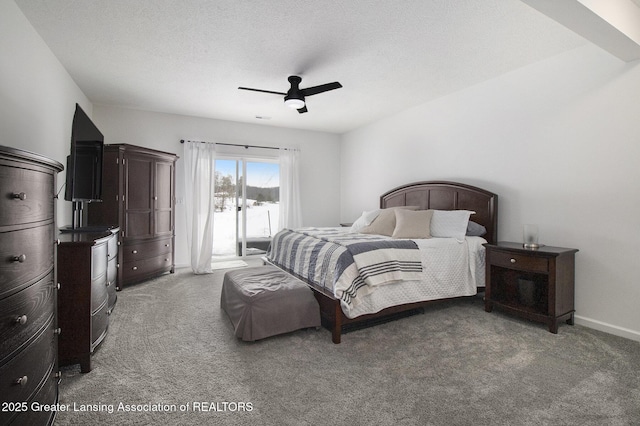 carpeted bedroom with a textured ceiling, access to outside, a ceiling fan, and baseboards