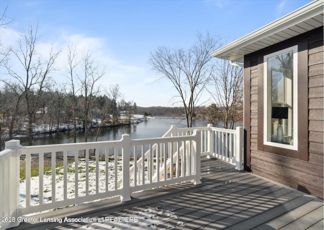 wooden terrace with a water view