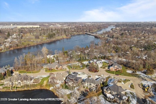 drone / aerial view with a water view and a residential view