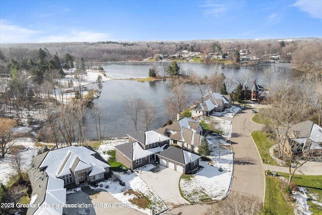 drone / aerial view featuring a residential view and a water view