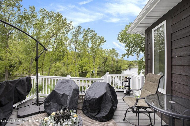 4125 Harbour Cv, Lansing, MI 48911 - wooden deck featuring a water view
