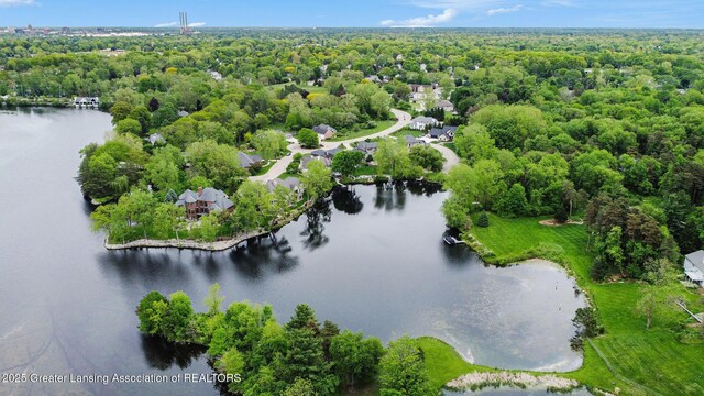 4125 Harbour Cv, Lansing, MI 48911 - drone / aerial view of a large body of water and a heavily wooded area