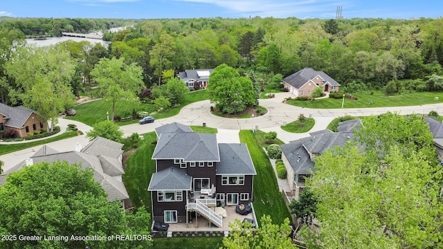 4125 Harbour Cv, Lansing, MI 48911 - aerial view of residential area with a heavily wooded area