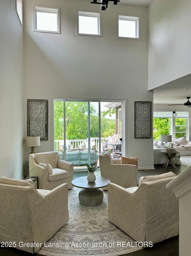 4125 Harbour Cv, Lansing, MI 48911 - living room featuring a high ceiling and a ceiling fan