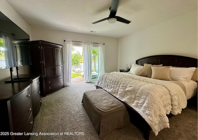 4125 Harbour Cv, Lansing, MI 48911 - carpeted bedroom featuring access to outside, a textured ceiling, and a ceiling fan