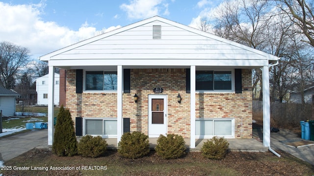 split foyer home with brick siding