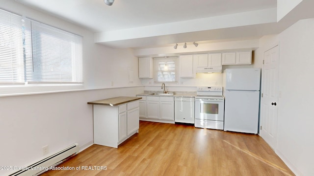 kitchen with white appliances, a baseboard radiator, under cabinet range hood, white cabinetry, and a sink