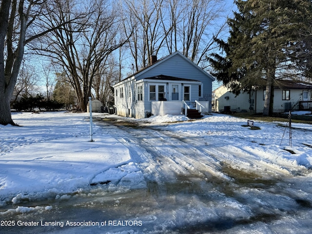 view of front of house with a chimney