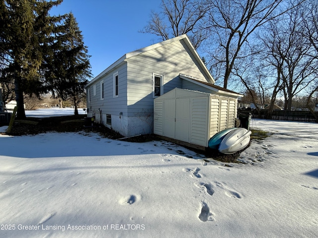 exterior space featuring a storage unit and an outdoor structure