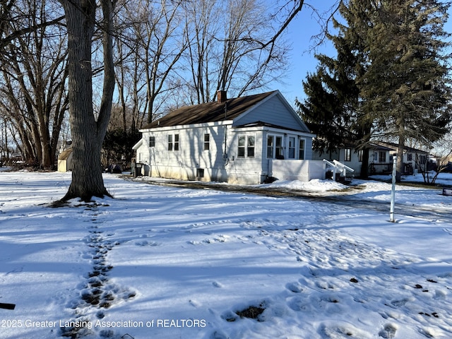 view of front of property featuring a chimney