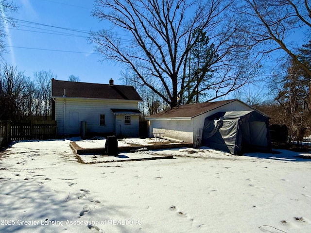 exterior space with a garage and fence