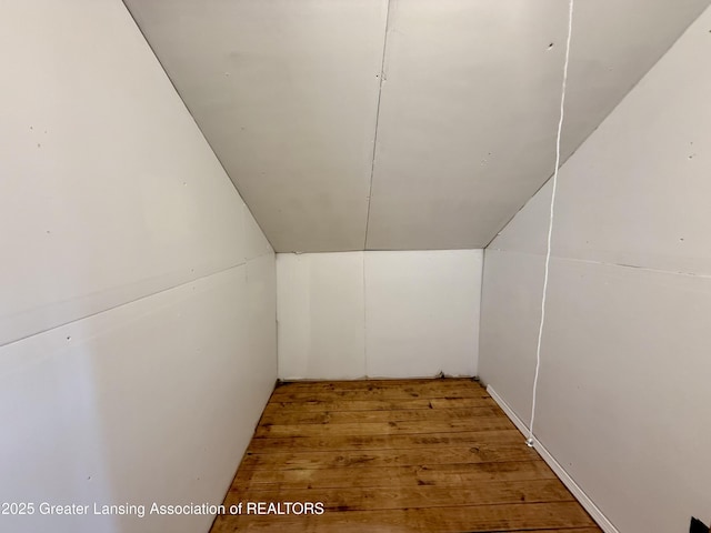 interior space with vaulted ceiling and wood finished floors